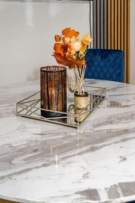 a glass table with two vases and flowers on it at The Pad in Paisley