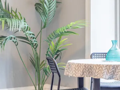 a dining room with a table and plants at Wonderful West End - Pass the Keys in Glasgow