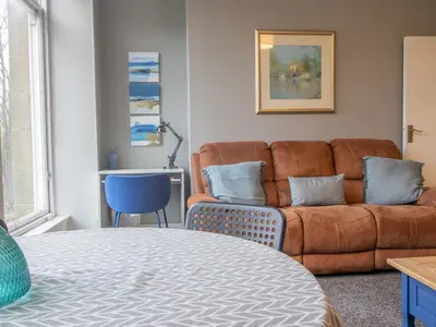 a living room with a couch and a table at Wonderful West End - Pass the Keys in Glasgow