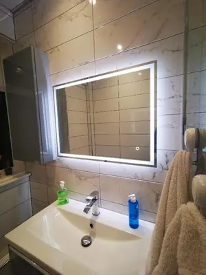 a bathroom with a sink and a mirror at Large bedroom, close to Airport and City Centre in Edinburgh