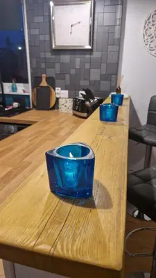 two blue bowls sitting on top of a wooden counter at 175 On Clyde - Spacious & Cosy Cedar Wood Bungalow in Helensburgh