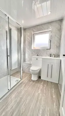a bathroom with a toilet and a shower at Lena House in Glasgow