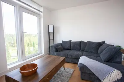a living room with a couch and a coffee table at Stylish Newly Decorated 2 Bed in Glasgow