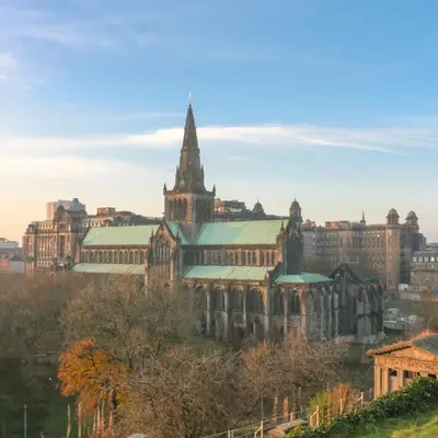 an old building with a tower and a church at 2 Bedroom Oasis in Glasgow City Centre in Glasgow