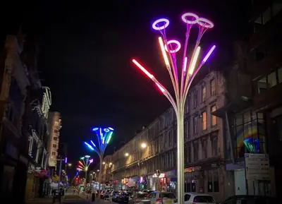 a street at night with colorful street lights at The Art Flat Glasgow in Glasgow