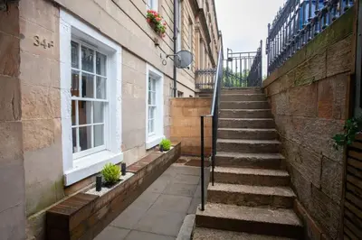 a set of stairs next to a building at Beautiful 2 Bed Flat with a Private Terrace in Glasgow