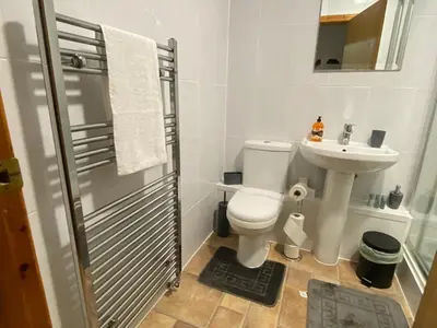 a small bathroom with a toilet and a sink at Pure East Coast Trainline by TBA in Fife