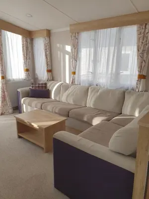 a living room with a couch and a coffee table at Lochgilphead Caravan Park in Lochgilphead