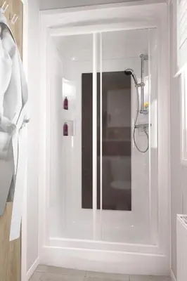 a shower with a glass door in a bathroom at Lochgilphead Caravan Park in Lochgilphead