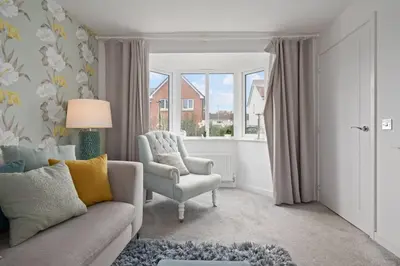 a living room with a couch and a chair and a window at 3BDR House By Vista Stays Short Lets & Serviced Accommodation Glasgow Scotland With Driveway Parking and PS4 in Glasgow