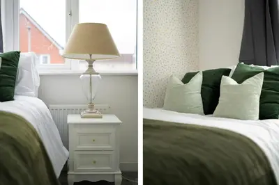 a bedroom with a bed and a lamp on a night stand at 3BDR House By Vista Stays Short Lets & Serviced Accommodation Glasgow Scotland With Driveway Parking and PS4 in Glasgow