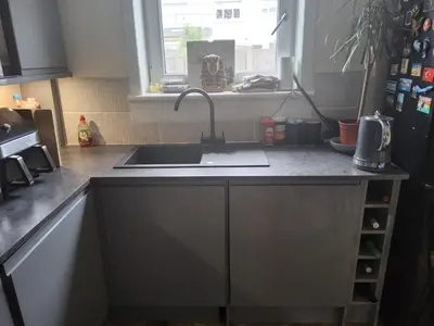 a kitchen counter with a sink and a window at Gadsby manor in Drumchapel