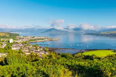 a view of a town and a body of water at THE RESTING LION - Gourock Town Center Holiday Home Apartment in Gourock
