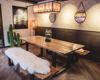 a wooden table with a bench and a table with a white rug at For Students Only Portsburgh Court Edinburgh in Edinburgh