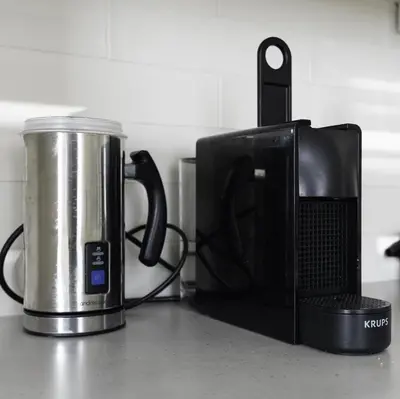 a coffee pot and a microwave on a counter at 3 BDR House By Caledonia Luxe Stays Short Lets & Serviced Accommodation Airdrie in Airdrie