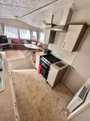 an overhead view of a kitchen with a stove top oven at Delta, Bromley 4-Bedroom Located in Uddingston, Glasgow at Maryville Caravan Site in Uddingston