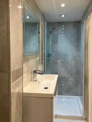a bathroom with a sink and a shower and a tub at Edinburgh city centre 1Bed flat near Castle & Uni in Edinburgh