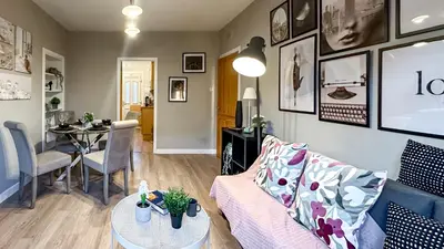 a living room with a couch and a table at Holly street house with Separate Entrance,Glasgow edge in Clydebank