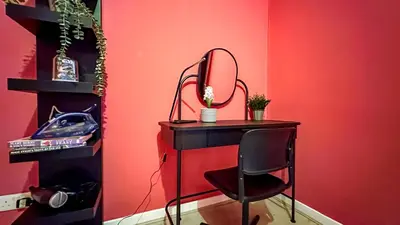 a desk with a mirror and a chair in a room at Holly street house with Separate Entrance,Glasgow edge in Clydebank