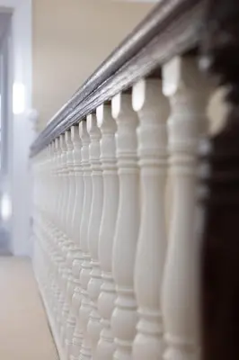 a close up of a white railing in a room at Extravagant 6 Bed Victorian Townhouse with Hot Tub in Glasgow