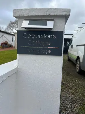 a sign for aconservatoireoperativeoperativeoperativeknifeknifeemetery at Gogarstone Cottage in EDI