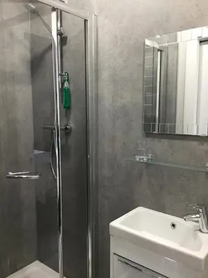 a bathroom with a shower and a sink at Amaryllis Guest House in Edinburgh