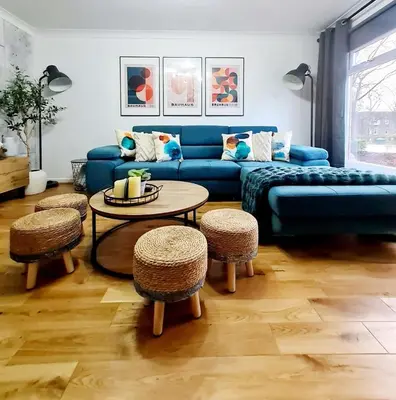 a living room with a blue couch and a table at Bright 3BR walking distance to town - FREE parking in Glasgow
