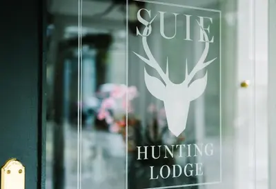 a sign on the door of a hunting lodge at Suie Hunting Lodge in Killin