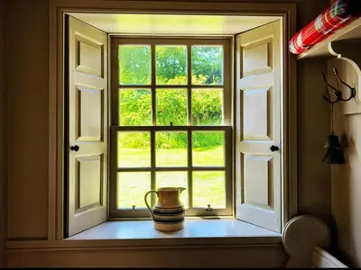 a window with a jug sitting on a window sill at 4 Bed in Cardross oc-t30303 in Cardross