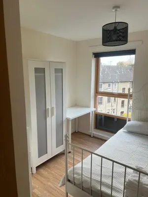 a bedroom with a bed and a window at Riverview Retreat Shawlands in Mansewood
