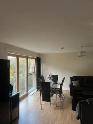 a living room with a dining room table and chairs at Riverview Retreat Shawlands in Mansewood