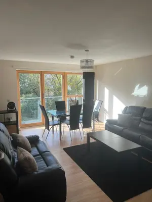 a living room with a couch and a table at Riverview Retreat Shawlands in Mansewood