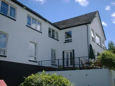 a white house with a black roof at Greencourt Guest House in Oban