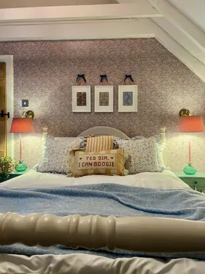 a bedroom with a large bed with two lamps at Clover Neuk - Hot Tub - Coorie Doon Stays in Fairlie