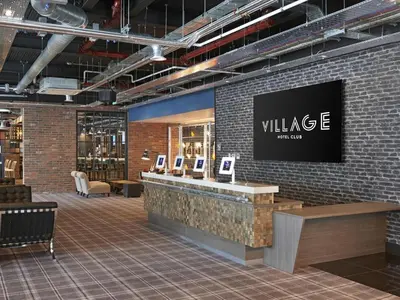 a wine store with a large sign on a brick wall at Village Hotel Glasgow in Glasgow