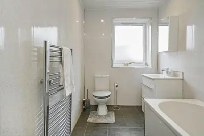 a white bathroom with a toilet and a sink at BridgeCity Hidden Gem in the heart of Falkirk Roughland house Stirlingshire in Carron