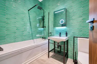 a bathroom with a sink and a tub and a shower at Large Central Station 2 Bed Apartment A2 in Glasgow
