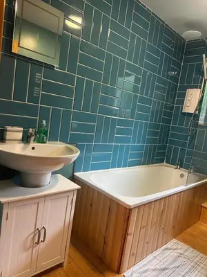 a bathroom with a sink and a bath tub and a sink at Callanish Bothy in Benderloch