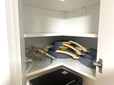 a cupboard filled with bowls and utensils at Charming home away from home! in Edinburgh