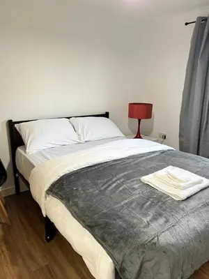 a bedroom with a bed with a towel on it at Charming home away from home! in Edinburgh