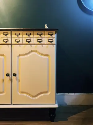 a yellow cabinet with a stove in a room at Central Designer Flat by Castle in Edinburgh