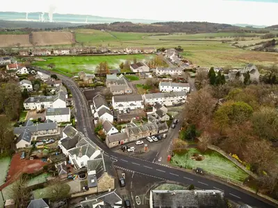 an aerial view of a small town with a road at The Post Office in Torphichen