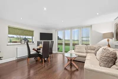 a living room with a couch and a table at Westcraigs in Westfield