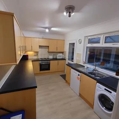 a large kitchen with a washer and dryer in it at RF-Entire House-Central Scotland-Falkirk, Self-Check-in , Pet-friendly and with Parking in Falkirk