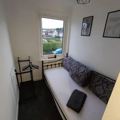 a white couch in a room with a window at RF-Entire House-Central Scotland-Falkirk, Self-Check-in , Pet-friendly and with Parking in Falkirk