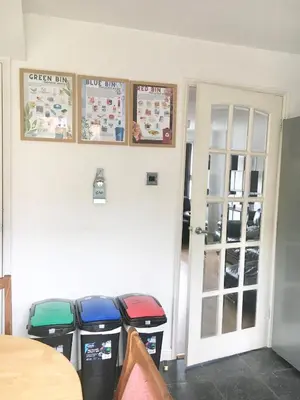 a room with two trash cans and posters on the wall at KH-Entire House -Central Scotland, Self-Check-in , Pet-friendly and with Parking in Falkirk