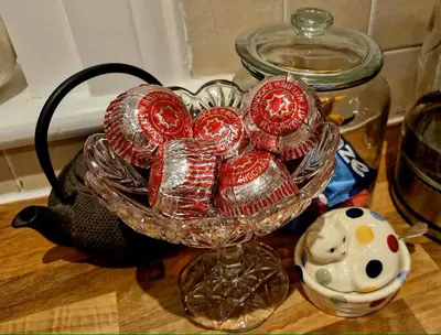 a glass bowl filled with candy on a table at Peace in the City in Edinburgh