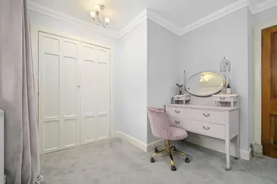 a dressing room with a desk and a mirror at The Strone Luss Premium Holiday Rental in Luss