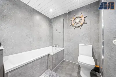 a bathroom with a toilet and a tub and a sink at Historic 3 Bed Private Parking Nr Railway Station in Wemyss Bay