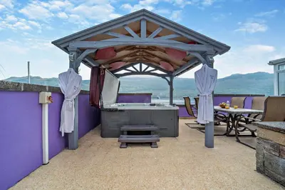 an outdoor gazebo with a table and a grill at 4 Bed in Lochgoilhead oc-j30107 in Carrick